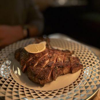 Sunny’s Steakhouse signature dishes Spice-Crusted Duck Breast, 8 Oz Prime Filet Mignon, Wagyu Carpaccio.